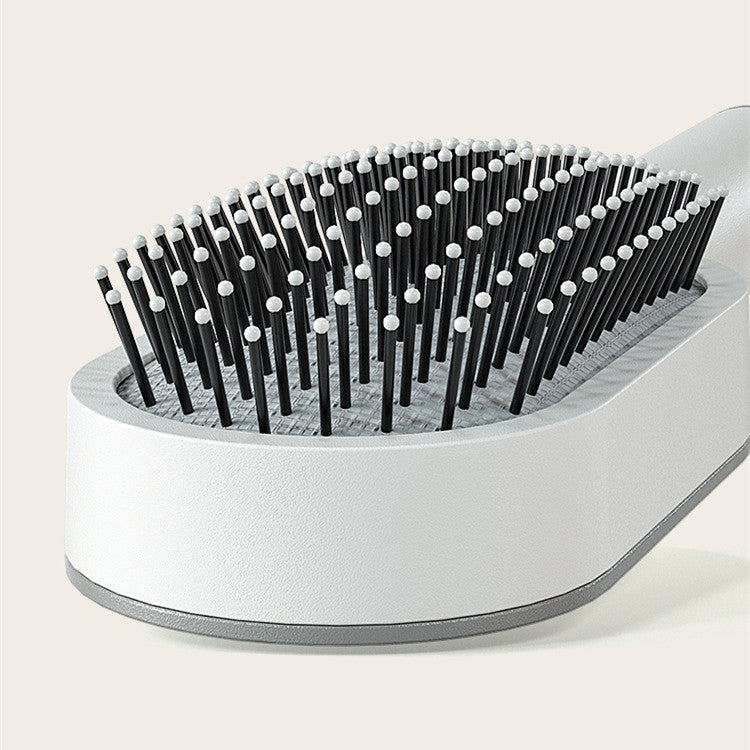 Nexova™ - Self Cleaning Hair Brush